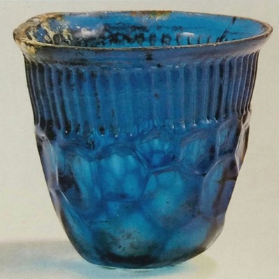 Cheonma Blue Glass Cup, <a href="https://english.cha.go.kr/chaen/search/selectGeneralSearchDetail.do?mn=EN_02_02&sCcebKdcd=12&ccebAsno=06200000&sCcebCtcd=37&pageIndex=1&region=&canAsset=&ccebPcd1=&searchWrd=CHEONMACHONG&startNum=&endNum=&stCcebAsdt=&enCcebAsdt=&canceled=&ccebKdcd=&ccebCtcd="target="_blank">Gyeongju National Museum, 002386-00000, NT620</a>; 5th-6th c.; Syria; EXH131: NT620