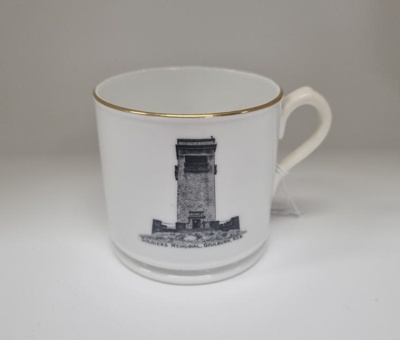 Souvenir china tea mug, with gold trim.  ; Gouldings Jewellers; c. 1920; 2025.958