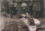 Copied official press photograph - Giving a drink to a wounded Tommy - Homecoming of B.E.F.; 41720
