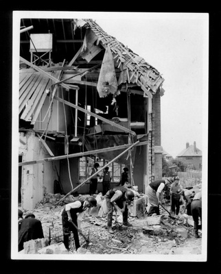 Official copyrighted war photograph- 22nd June 1940- arp workers amongst the wreckage of a house where three people died during air raid; 56525