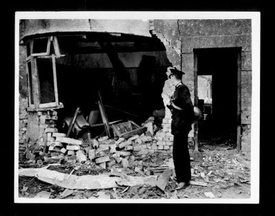 Official copyrighted war photograph- 25th June 1940- smashed sitting room of house bombed in raid on South/west England; 56470