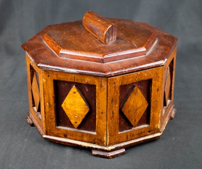 8 Sided Wooden Box with hinged lid and decorative diamond pattern. Approx 20 cm diameter. Made by German POW Albert Schimtz from POW camp near East Witton, Wensleydale.; 78127