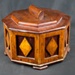 8 Sided Wooden Box with hinged lid and decorative diamond pattern. Approx 20 cm diameter. Made by German POW Albert Schimtz from POW camp near East Witton, Wensleydale.; 78127