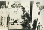 Photograph - Japanese Army Officers signing surrender document in view of Allied Naval Officers; 38040