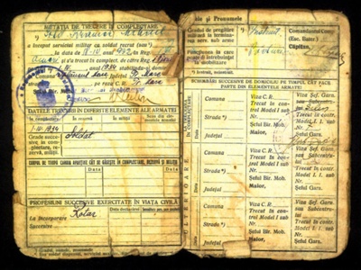 Photocopied documents relating to Michael Kramer including service book. registration document. discharge document. German Red Cross resettlement form.; 76090