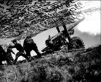 Photograph - Polish gunners with field artillery under camouflage netting; 2638