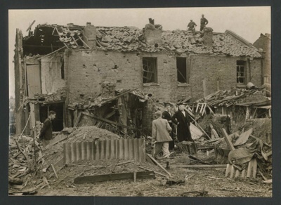 Official copyrighted war photograph- 23rd August 1940- bomb damage to houses on outskirts of London; 56567