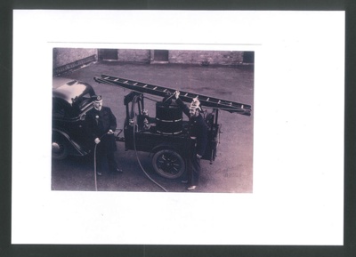 Photocopy of Photograph of Fred Wood and his son Tom with homemade Fire Trailer; 79831 Photocopy of Photograph of Fred Wood and his son Tom with homemade Fire Trailer; 79831