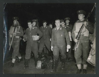 Official copyrighted war photograph - undated - Nazi airmen prisoners boarding a train at a London station; 56575