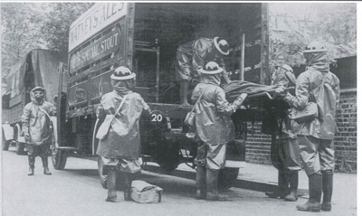 Computer disc - contains photograph of A.R.P gas contamination squad loading stretcher on to Watney's Ales lorry; 35575