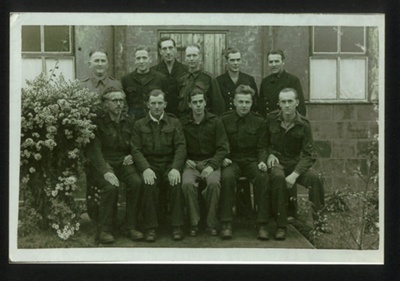 Photograph - Group of 11 German prisoners at Eden Camp - Alfred Brandt is in the centre on the front row; 37911 Photograph - Group of 11 German prisoners at Eden Camp - Alfred Brandt is in the centre on the front row; 37911