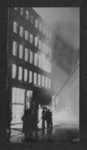 Photograph - fire hoses in action after a bombing raid in Manchester - 1940; 1/01/1940; 6812 Photograph - fire hoses in action after a bombing raid in Manchester - 1940; 1/01/1940; 6812