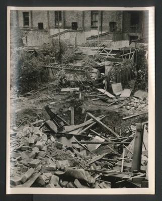 Official copyrighted war photograph- 25th August 1940- Anderson shelter remains intact after direct hit demolished house; 56556
