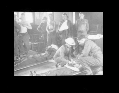 Photograph - Portsmouth doctor (Dr. Una Mulvany) demonstrates how to treat a wartime casualty; 6876 Photograph - Portsmouth doctor (Dr. Una Mulvany) demonstrates how to treat a wartime casualty; 6876