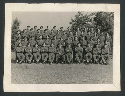 Group photograph - unidentified unit - possibly part of 29th inf bde R.A.O.C. - possibly includes L/Cpl G.B. Harrison; 34408