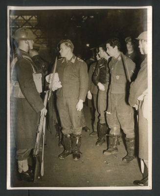 Official copyrighted war photograph - 29th October 1940 - German airmen under escort at a London station; 56578