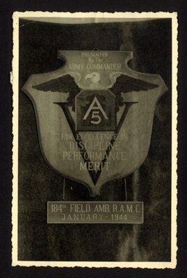 Postcard- Royal Army Medical Corps- Jan 1944 ( photo of plaque presented by Army Commander to 184th field AMB ; 79123