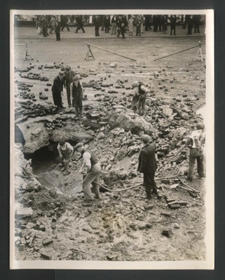 Official copyrighted war photograph- 7th September 1940- crater caused by bombing in London area; 56557