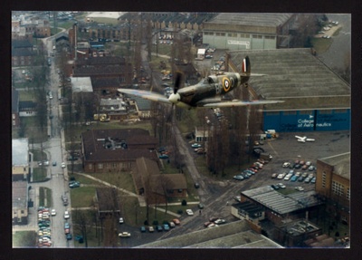 Photograph (colour) - Spitfire MK V ab910 - R.A.F. 457 squadron - airborne over Cranfield College of Aeronautics; 6350