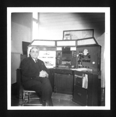 Photograph - telephone operator at desk - possibly fire service; 5565 Photograph - telephone operator at desk - possibly fire service; 5565