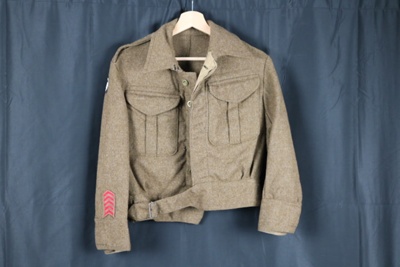 Army battledress blouson (khaki) formation badges on each arm - 30th corp (black leaping boar). 2 medal ribbons in pocket - 1939-45 Star, France & Germany Star, Defence Medal.; 72665