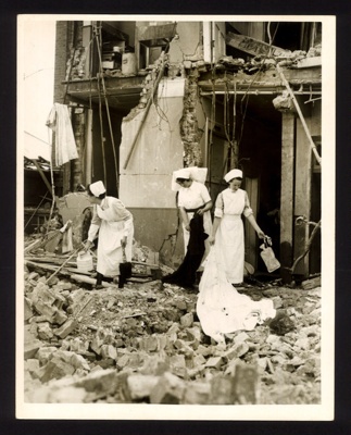 Official copyrighted war photograph- 8th September 1940- nurses look amongst debris of bombed hospital Wards; 56515