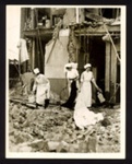 Official copyrighted war photograph- 8th September 1940- nurses look amongst debris of bombed hospital Wards; 56515