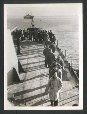 Official copyrighted war photograph - undated - German merchant seamen line up to thank Captain of British warship for kind treatment; 56585