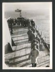 Official copyrighted war photograph - undated - German merchant seamen line up to thank Captain of British warship for kind treatment; 56585 Official copyrighted war photograph - undated - German merchant seamen line up to thank Captain of British warship for kind treatment; 56585
