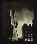 Photograph - firemen climbing ladder into burning bomb damaged building; 6804