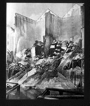 Photograph - cascades of smouldering grain from bombed Warehouses slide into river Humber in Hull; 6811