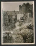 Official copyrighted war photograph- 20th September 1940- burning wreckage of bomber amongst debris in London area; 56553