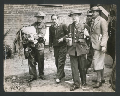 Official copyrighted war photograph - undated - young Nazi airman under police escort after being shot down; 56577