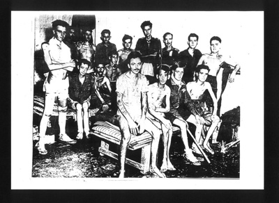 Copy of photograph - British P.O.W.'s in barrack room - prisoners of the Japanese; 7600 Copy of photograph - British P.O.W.'s in barrack room - prisoners of the Japanese; 7600