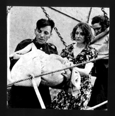 Photograph - "Child victim of "Athenia" in man's arms"; 8978 Photograph - "Child victim of "Athenia" in man's arms"; 8978