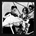 Photograph - "Child victim of "Athenia" in man's arms"; 8978