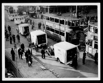 Official copyrighted war photograph- 25th October 1940- ambulances attending casualties after daylight raid; 56477