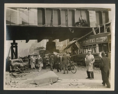 Official copyrighted war photograph- 25th October 1940- damaged trams amongst debris after daylight raid; 56555
