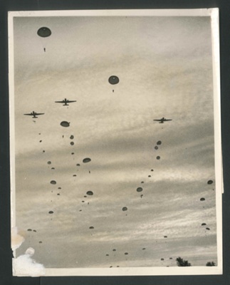 Photograph - airborne regiment baling out of transport aircraft during practice "drops" - 22/04/1944; 22/04/1944; 2617