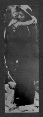 Photograph - a woman air raid Warden comforting a grief-stricken child; 6839 Photograph - a woman air raid Warden comforting a grief-stricken child; 6839