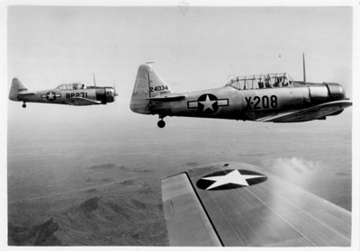Two AT-6 Harvard/Texan Advanced Trainers in Flight in formation with a third - 1941-45; 84042