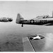 Two AT-6 Harvard/Texan Advanced Trainers in Flight in formation with a third - 1941-45; 84042 Two AT-6 Harvard/Texan Advanced Trainers in Flight in formation with a third - 1941-45; 84042