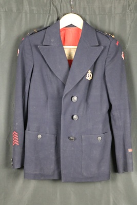 Red Cross jacket. belonged to Mary Pegg, Derby city hospital. assortment of badges sewn inside jacket from soldiers she nursed. R.A.M.C.; 69695
