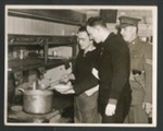 Official copyrighted war photograph - 14th November 1939 0 2 German officer prisoners cooking in a P.O.W. camp; 56573 Official copyrighted war photograph - 14th November 1939 0 2 German officer prisoners cooking in a P.O.W. camp; 56573