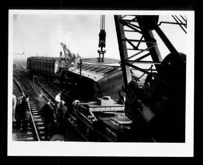 Official copyrighted war photograph- 20th October 1940- clearing damaged train coach from rails after bombing raid; 56522