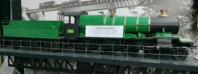 Model Steam Train, Tender and Track/Stand; Tom Day; 2025.2212 LOAN Model Steam Train, Tender and Track/Stand; Tom Day; 2025.2212 LOAN