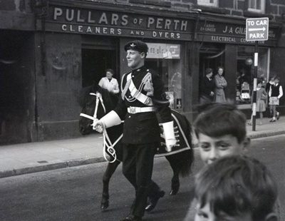 fht.2026.102  pullars of perth, cleaners, at 45 high street from1926 to 1980, and ja gilbert, electricians, at 45a, from 1935 to 1962, pictured in the 1960's.