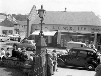 fht.2026.117  wedding at the high church in the early 1960's with the co-operative butcher and drapery shops at 40 and 42 high street in the background.