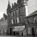 rm - fornari's hairdresser, no 118 high street, then angus the tailor, no 122, wm low's at  no 126, with longview hotel above, then archie macdonald, painters at no 128, taken in 1963.