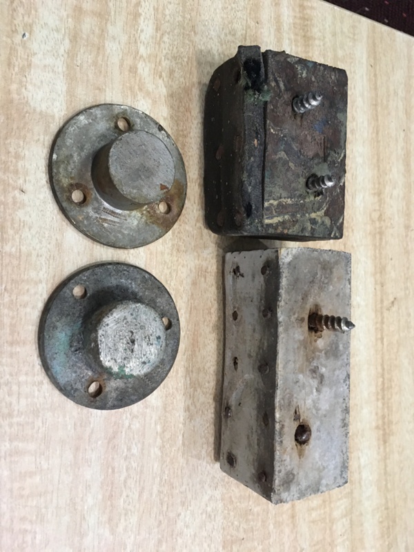 2 metal infloor door stops, and 2 wood door stops; early to mid 1900s